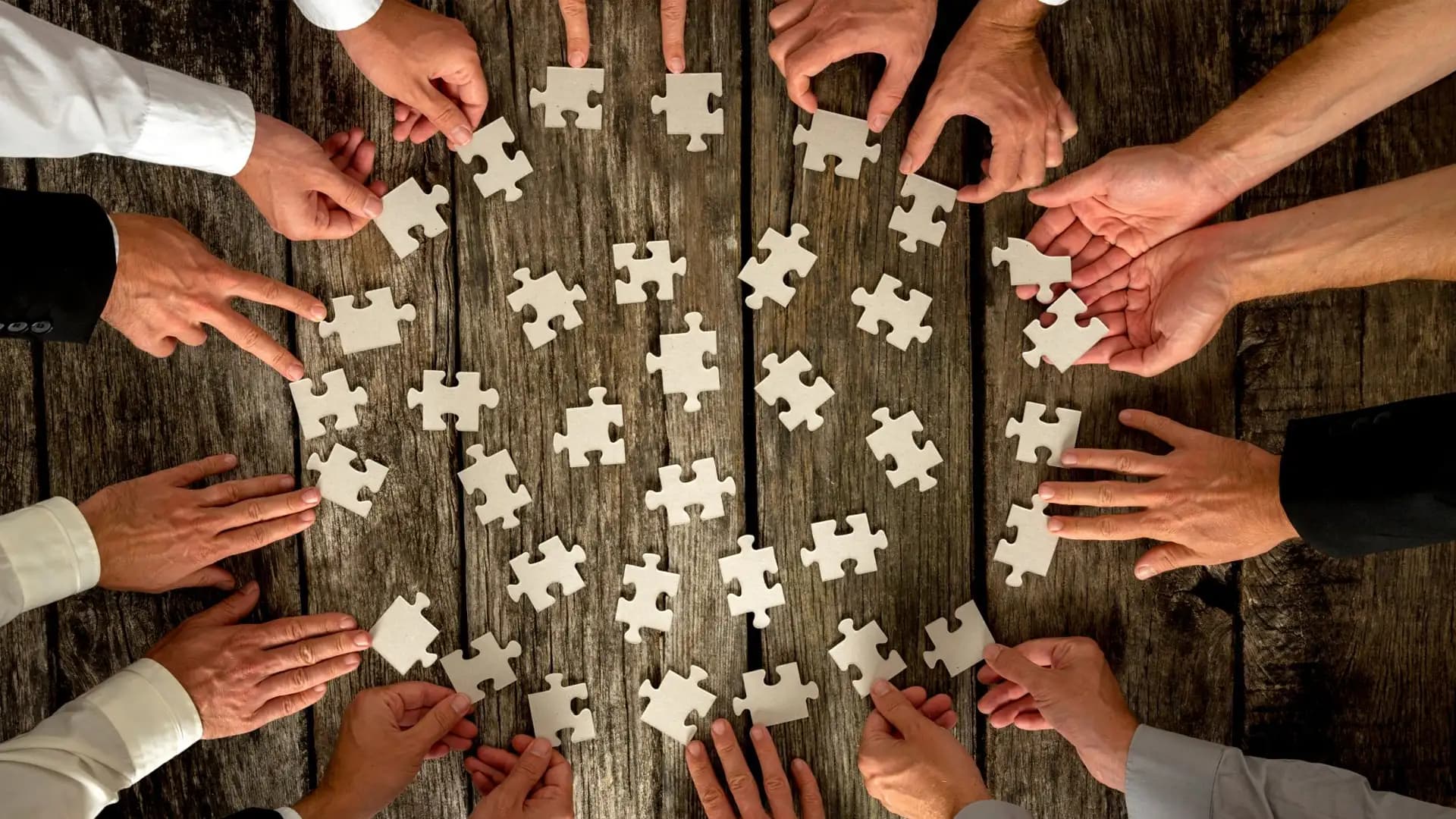 A modern glass facade of a corporate building, reflecting the sky.