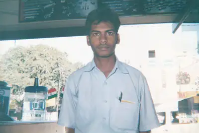 An older photo of M. Saravanan during his early years at the company