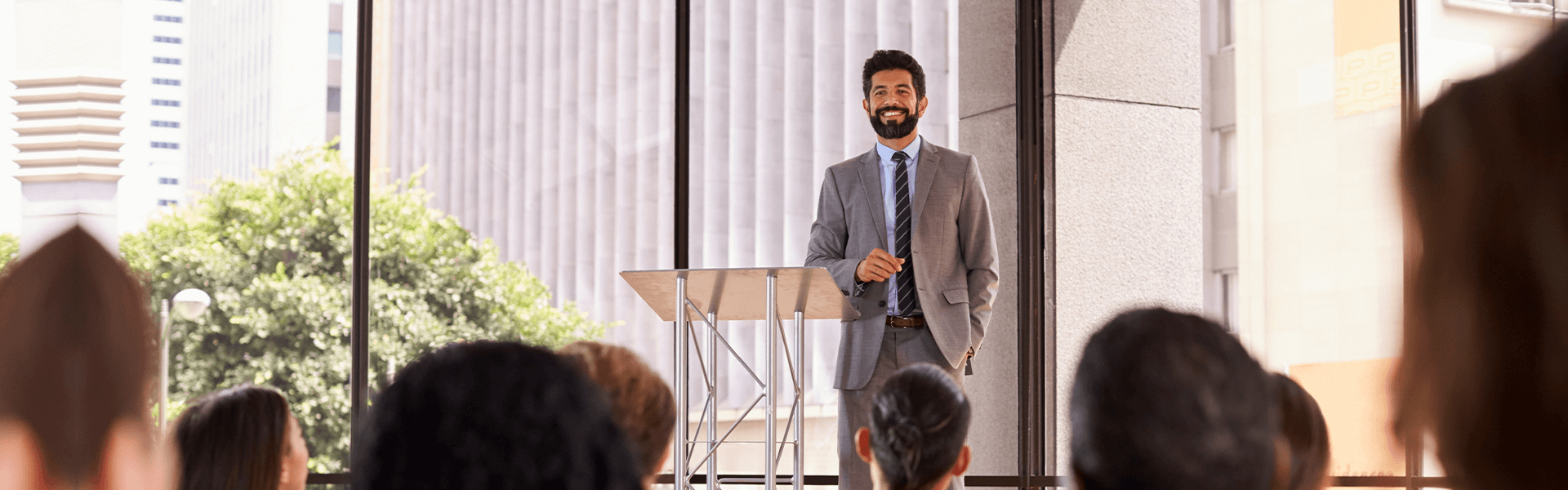 An expert leading a technical awareness session in a conference room.